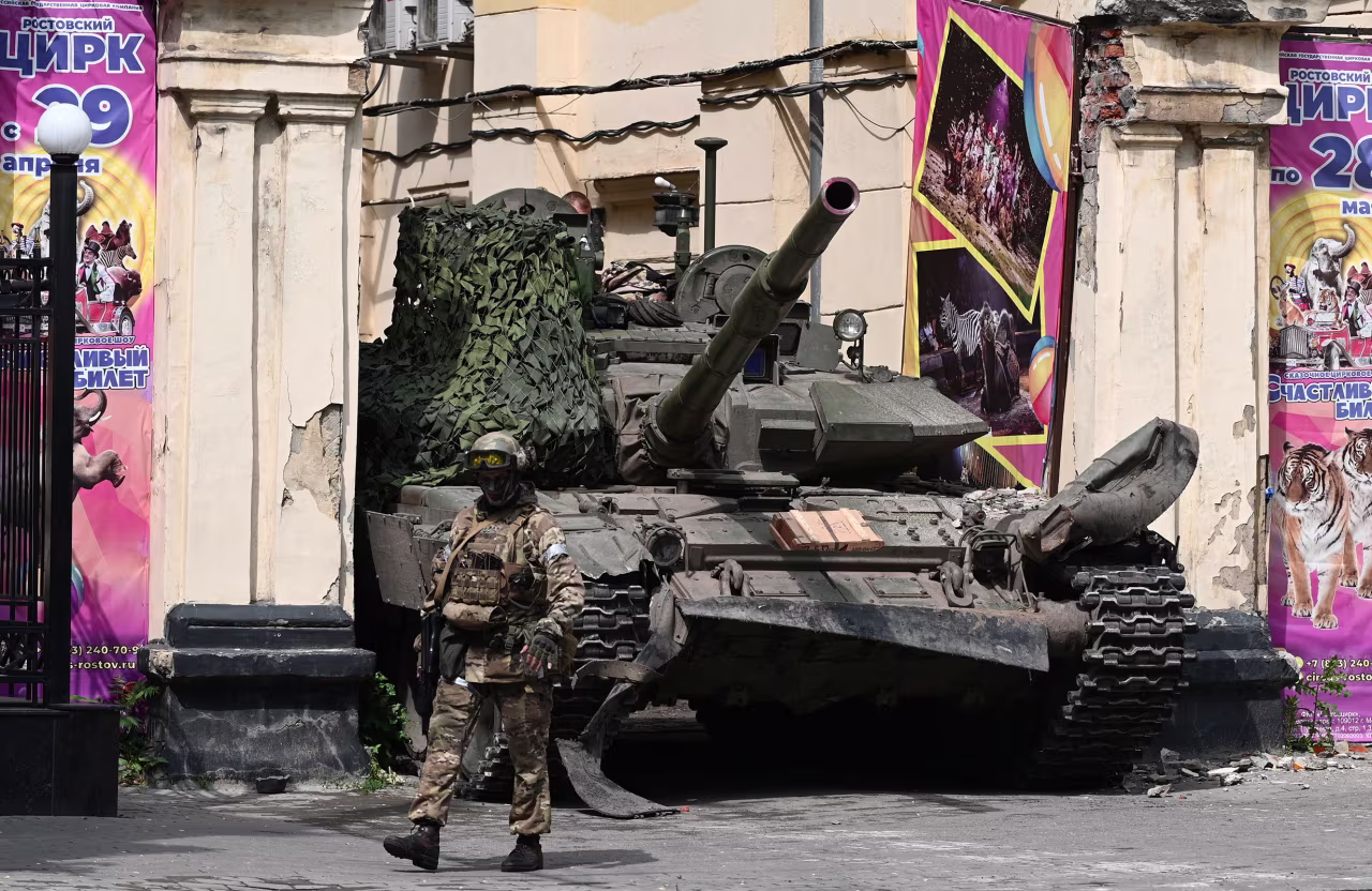 A Wagner fighter walks past a tank in Rostov-on-Don, Russia, on June 24. 