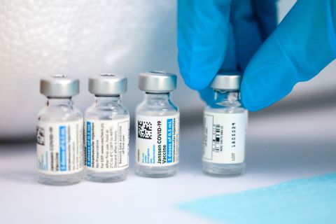 A nurse puts down a vial of the Johnson & Johnson Covid-19 vaccine in Oakland, California, on March 26.