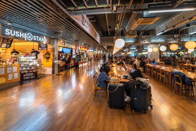 2H5M5KX tokyo, japan - december 06 2019: Japanese restaurants of Sushi and local dishes aligned in the food court of the domestic terminal 3 of Narita Interna