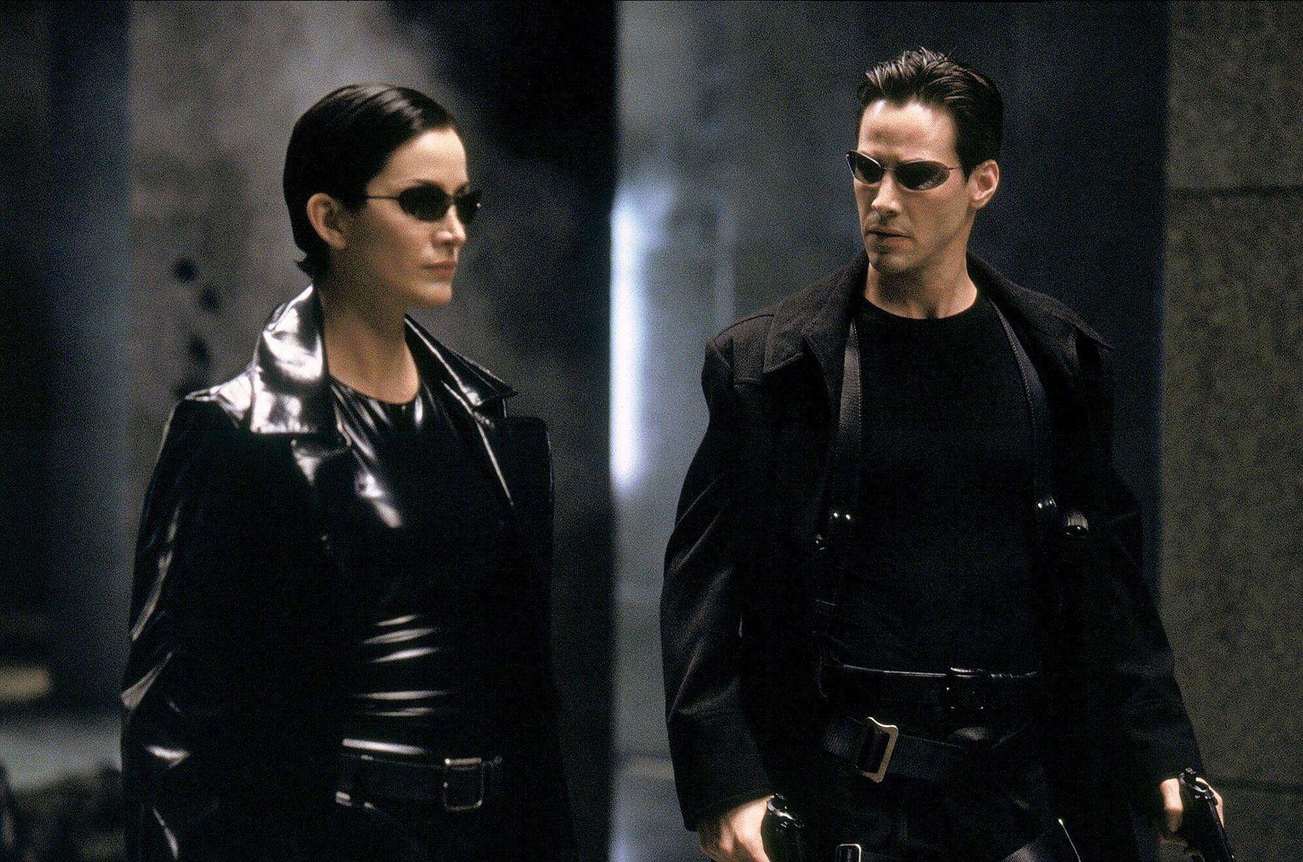 Carrie-Ann Moss and Keanu Reeves's styling in 