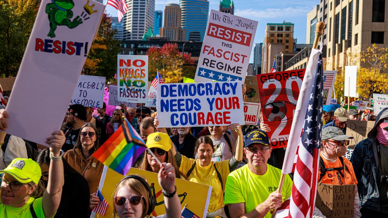 TOPSHOT - Protesters rally during the "No Kings" national day of protest in Minneapolis, Minnesota, on October 18, 2025. From New York to San Francisco, millions of Americans are expected to hit the streets to voice their anger over President Donald Trump's policies at nationwide "No Kings" protests. (Photo by Kerem YUCEL / AFP) (Photo by KEREM YUCEL/AFP via Getty Images)