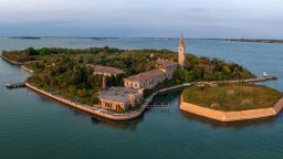 Aerial view of the plagued ghost island of Poveglia in the Venetian lagoon