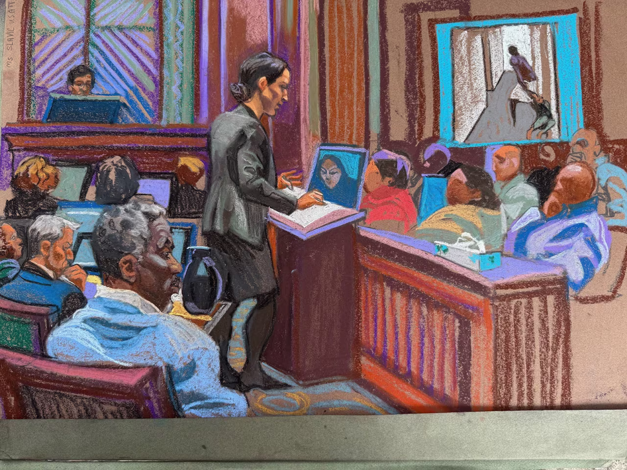 Assistant US Attorney Christy Slavik makes the case for the government, as the defendant looks on.