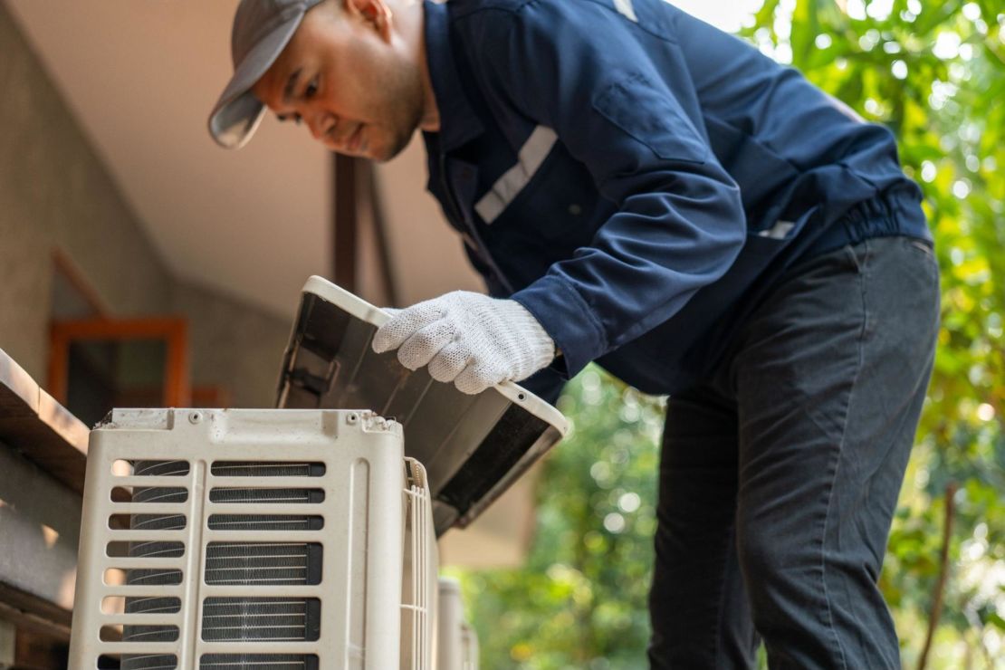 HVAC technician doing an HVAC tune-up