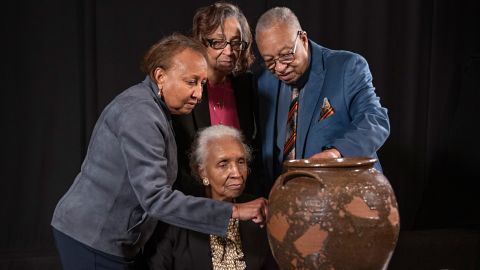 Pauline Baker, Daisy Whitner, John Williams, and Priscilla Williams Carolina, descendants of potter David Drake, at the Museum of Fine Arts, Boston, with one of the artist’s works. 

With art object:
Jar
Dave Drake (or Dave the Potter) (American, about 1800–about 1870)
1857
Stoneware with alkaline glaze
* Ethically borrowed from the Dave the Potter Legacy Trust LLC, established for the benefit of the artist's descendants
* Photograph © Museum of Fine Arts, Boston