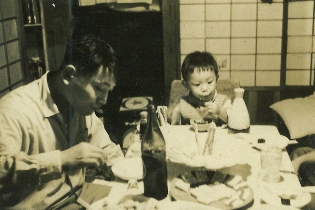 A photo of my dad, as a toddler, with my grandfather.