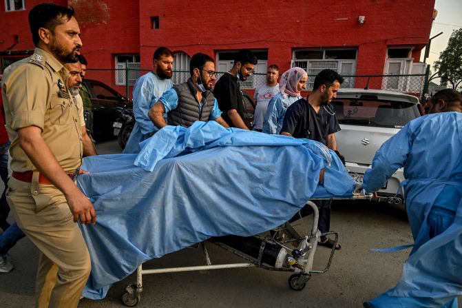 Paramedics and police personnel help an injured tourist after <a  target="_top" href="/newspapers?url=https://www.cnn.com/2025/04/22/asia/gunmen-open-fire-jammu-kashmir-intl/index.html">an attack</a> in the disputed Himalayan region of Jammu and Kashmir on Tuesday, April 22. Gunmen killed at least 26 people and injured a dozen others.