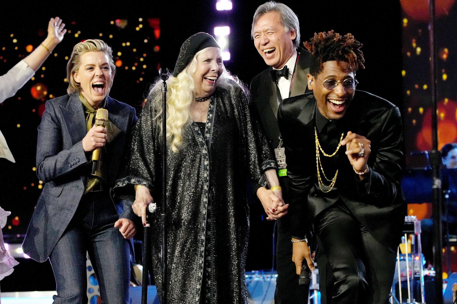 Mitchell joins Brandi Carlile and Jon Batiste on stage during the 2022 MusiCares Person of the Year event honoring Mitchell.
