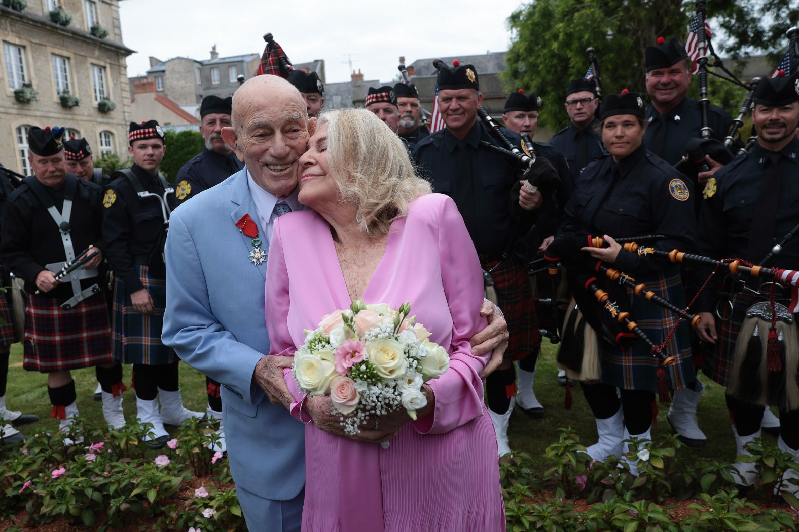 Harold Terens, an 100-year-old World War II veteran, embraces his 96-year-old bride, Jeanne Swerlin, at <a href="https://www.cnn.com/2024/06/10/europe/wwii-vet-marries-intl-scli/index.html">their wedding ceremony</a> in Carentan-les-Marais, France, on Saturday, June 8.