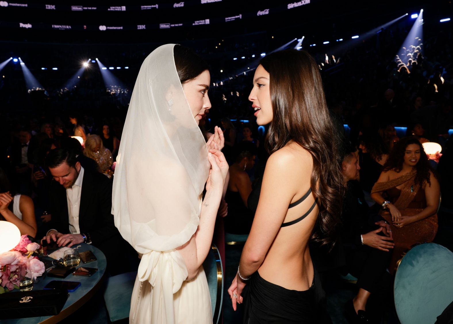 Gracie Abrams, left, and Olivia Rodrigo talk during a break in the show.