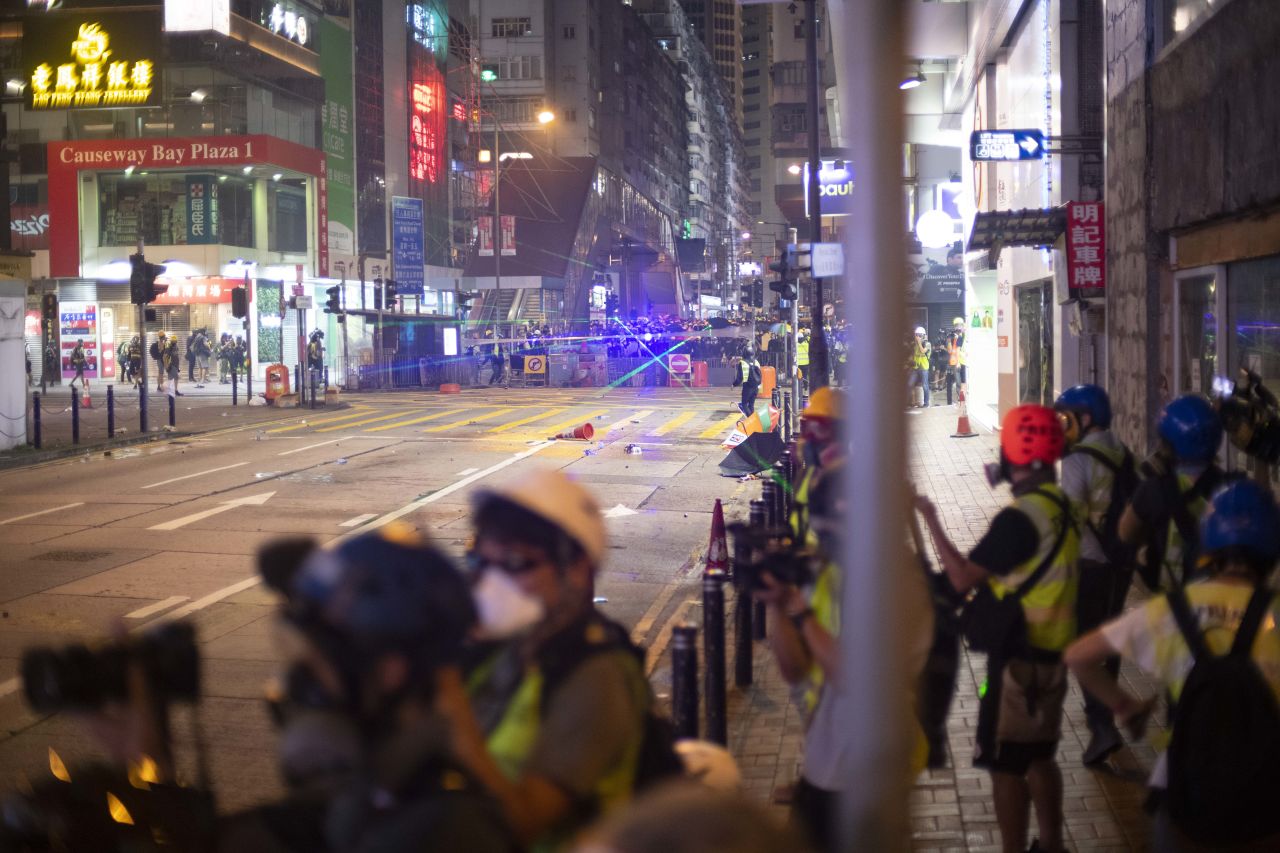 Protesters use laser pointers during a standoff with police in Hong Kong's Causeway Bay Sunday night.