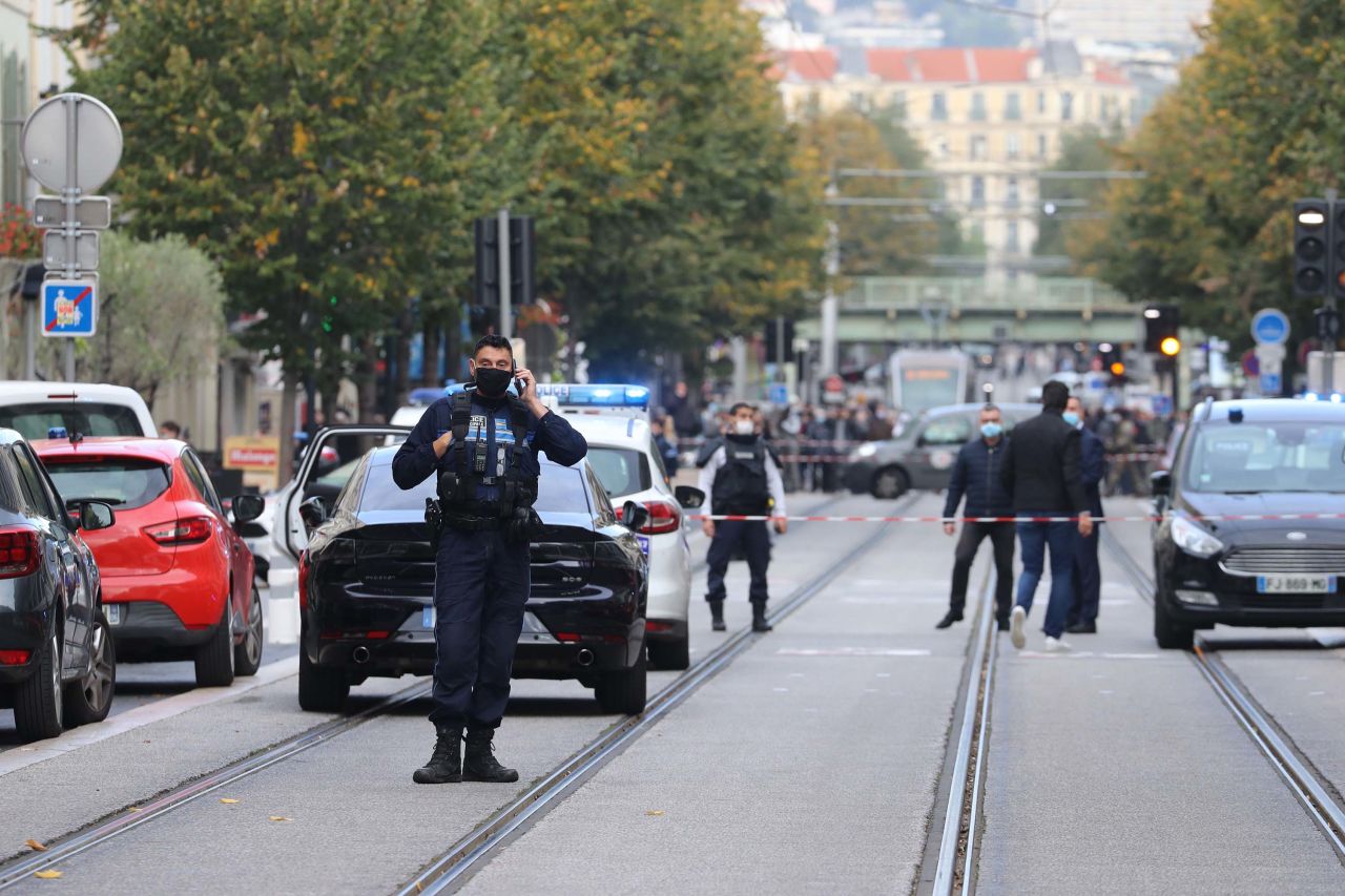 French policemen stand guard on a street in Nice, France, following a knife attack on Thursday, October 29.