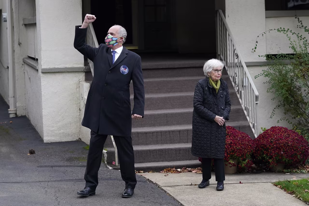 Sen. Bob Casey gestures while standing with his mother, Ellen Harding Casey, in Scranton, Pennsylvania, on Tuesday, November 3. 