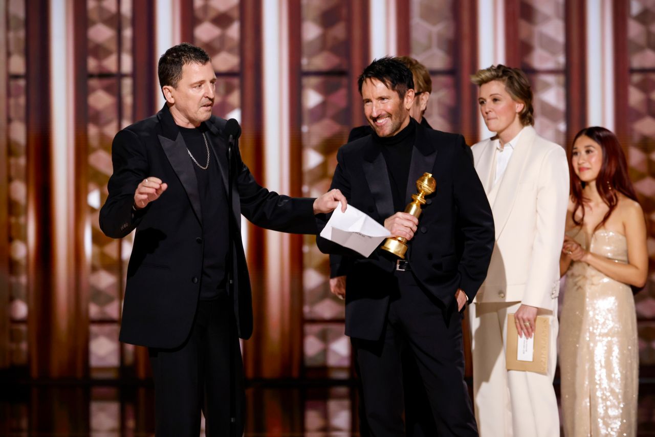 Atticus Ross and Trent Reznor accept the award for best original score for "Challengers."