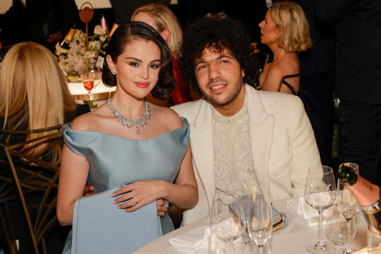 Selena Gomez and Benny Blanco pose for a photo.