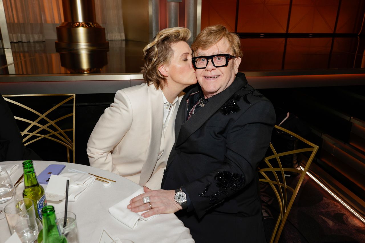 Brandi Carlile kisses Elton John.