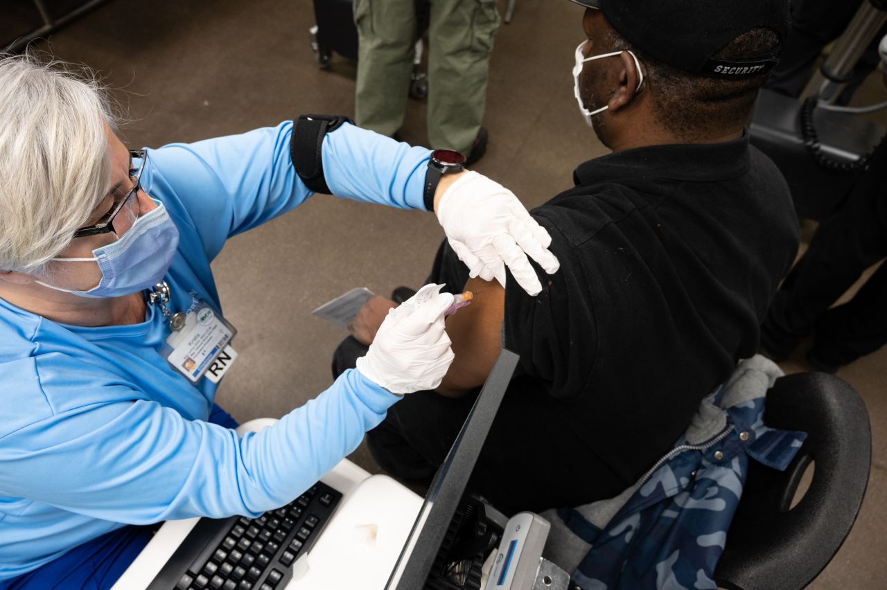 A nurse administers a Johnson & Johnson COVID-19 vaccine to a patient at Wayside Christian Mission on March 15 in Louisville, Kentucky. 