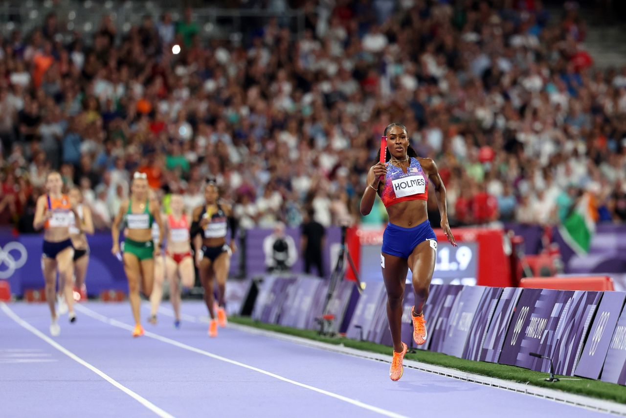 Team USA's Alexis Holmes races to win the women's 4x400-meter relay Saturday. 