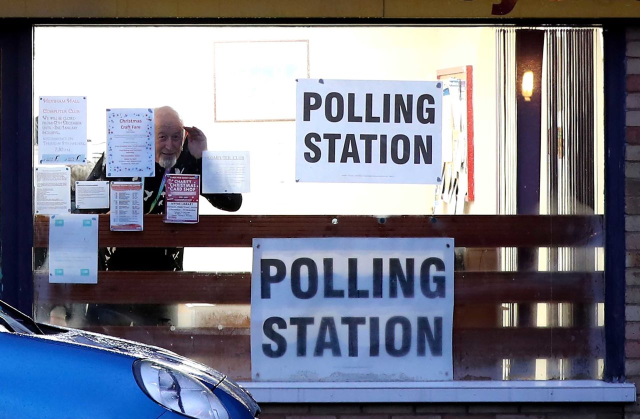 Signage is seen at a polling station in Lydd, England, early on Thursday. Photo: Gareth Fuller/PA Images via Getty Images