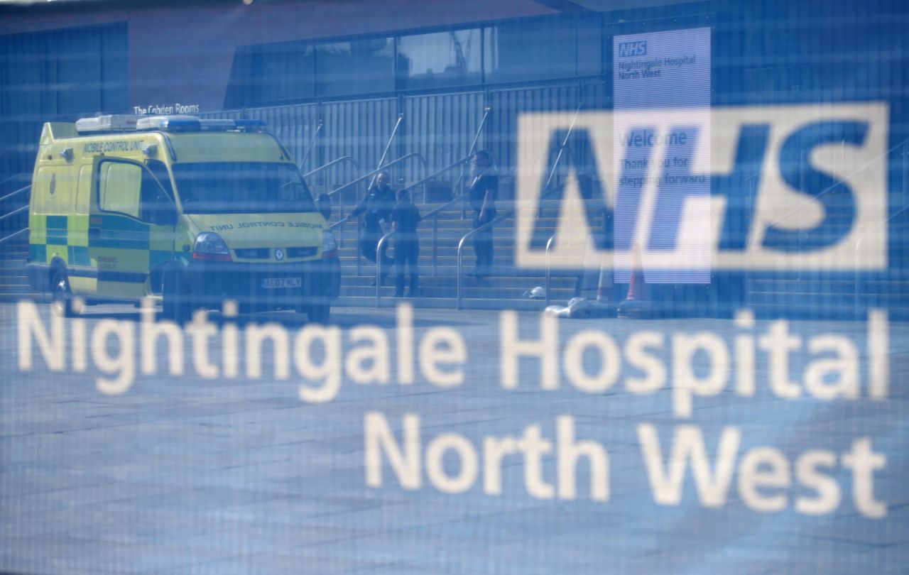 North West Ambulance Service medical staff stand outside Nightingale Hospital North West in Manchester, England, on April 13.