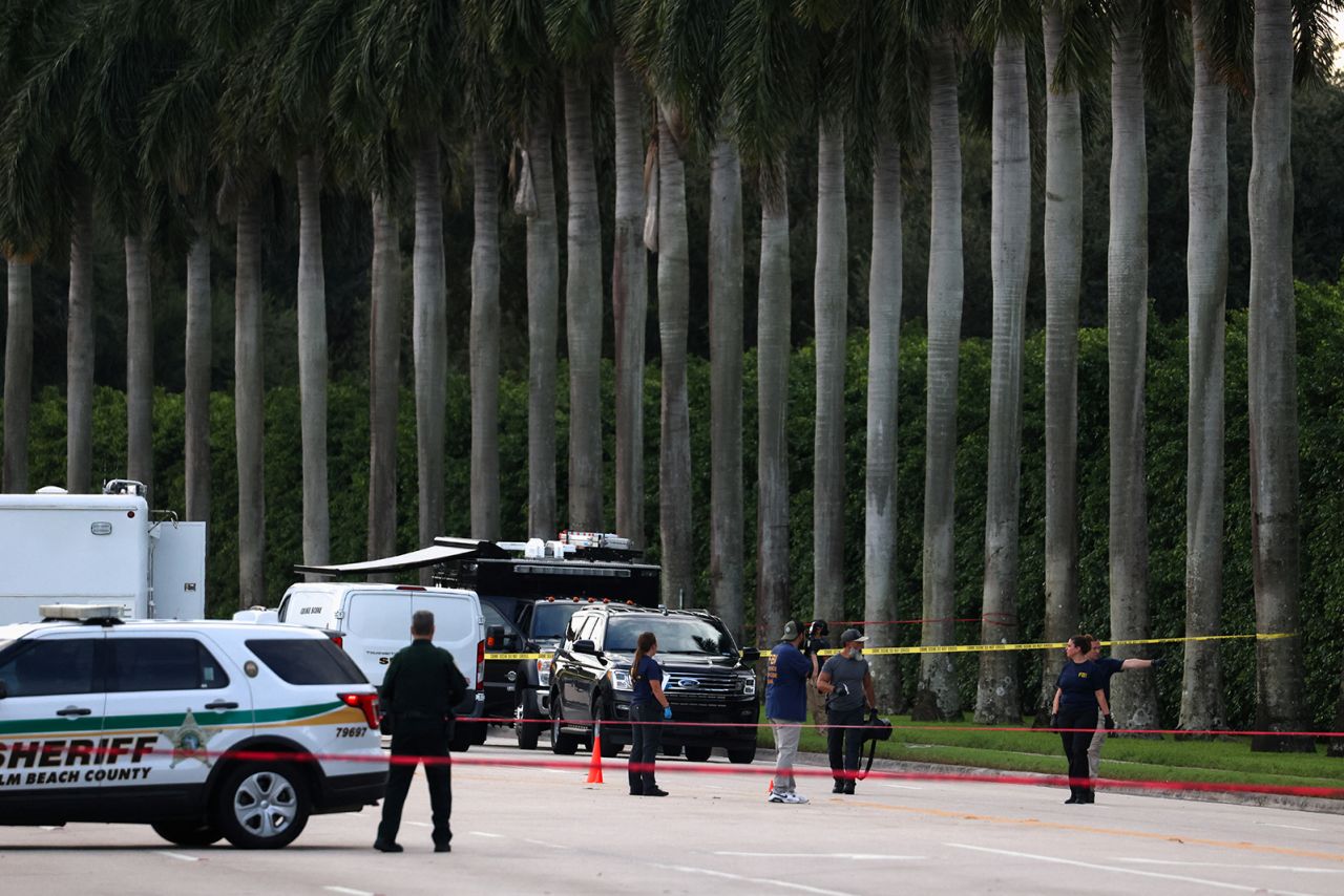 Law enforcement officers work around Trump International Golf Club after an apparent assassination attempt of former President Donald Trump on September 15.