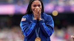 Women's long jump gold medalist Tara Davis-Woodhall, of the United States, reacts on the podium on Friday, August 9. 