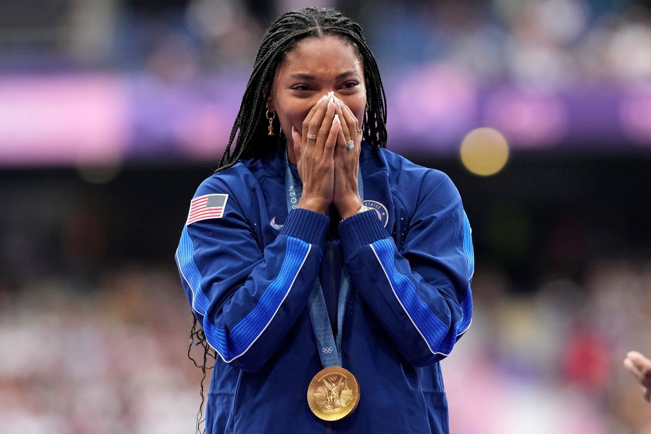 Women's long jump gold medalist Tara Davis-Woodhall, of the United States, reacts on the podium on Friday, August 9. 