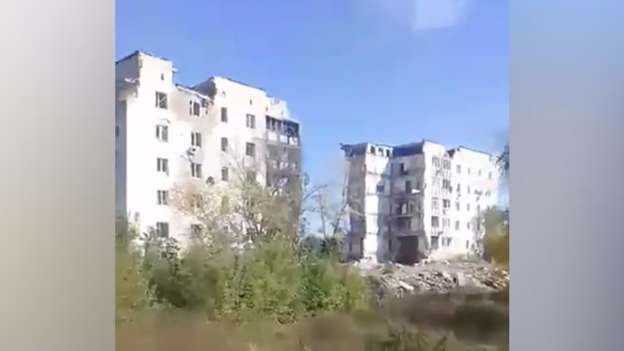 Only rubble remains between the two towers at 2 Pershotravneva in Izium, pictured on September 30. Multiple families sheltering in the basement beneath the central part of the building were killed.