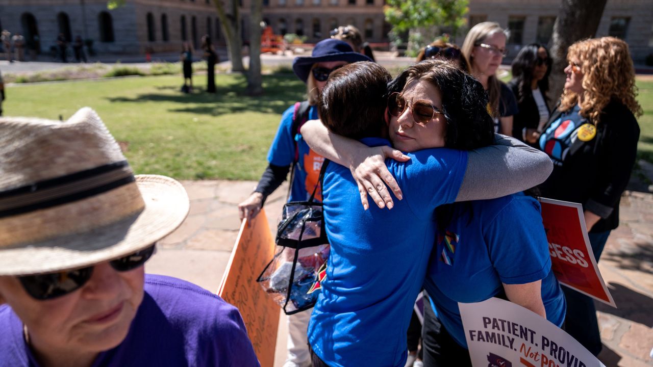 Abortion rights activists Marion Weich hugs Carolyn LaMantia during a news conference addressing the Arizona Supreme Court's ruling to uphold a 160-year-old near-total abortion ban at the Arizona state Capitol in Phoenix on April 9.