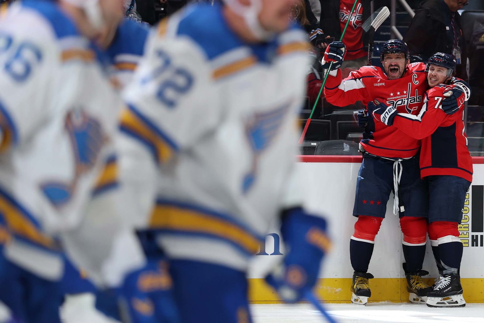 Washington Capitals forward Alex Ovechkin, second from right, celebrates with teammate Anthony Beauvillier after <a href="index.php?page=&url=https%3A%2F%2Fwww.cnn.com%2F2025%2F11%2F05%2Fsport%2Fnhl-capitals-alex-ovechkin-900-goals">scoring his 900th career goal</a> on Wednesday, November 5. Ovechkin broke the all-time record in April, passing Wayne Gretzky with goal No. 895.