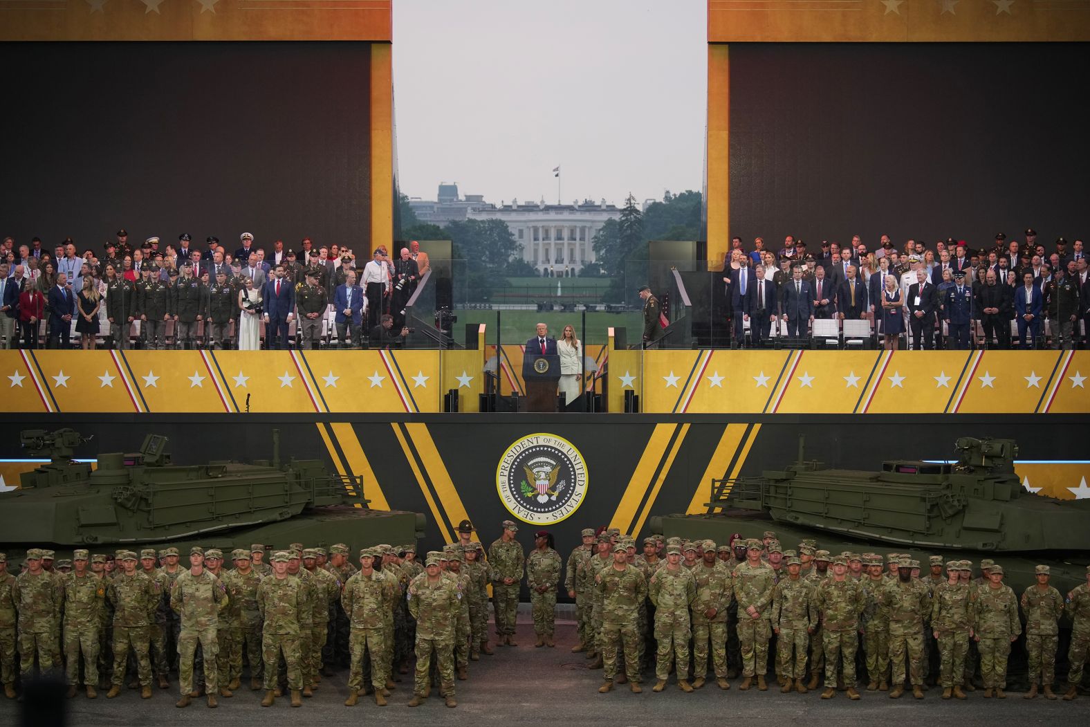 US President Donald Trump and first lady Melania Trump stand together at the end of a parade in Washington, DC, marking the 250th anniversary of the US Army on Saturday, June 14. The president, who also turned 79 on Saturday, had long pushed for <a href="index.php?page=&url=https%3A%2F%2Fwww.cnn.com%2F2025%2F06%2F14%2Fpolitics%2Fgallery%2Ftrump-parade-military-photos">the military parade</a>, which was the largest that the nation’s capital had seen in decades.