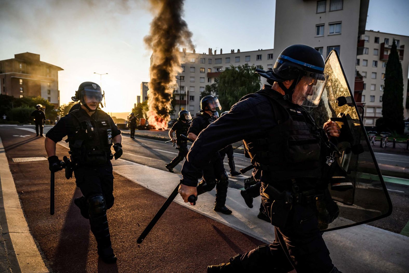 Police officers run during clashes with protesters in Toulouse, France, on Wednesday, September 10. <a href="index.php?page=&url=https%3A%2F%2Fwww.cnn.com%2F2025%2F09%2F10%2Feurope%2Ffrance-protests-new-prime-minister-intl">Nationwide unrest broke out across France on Wednesday</a> as protesters blocked roads, set fires and clashed with police, who responded with tear gas. The protests — called months ago — were aimed at President Emmanuel Macron and the political class.