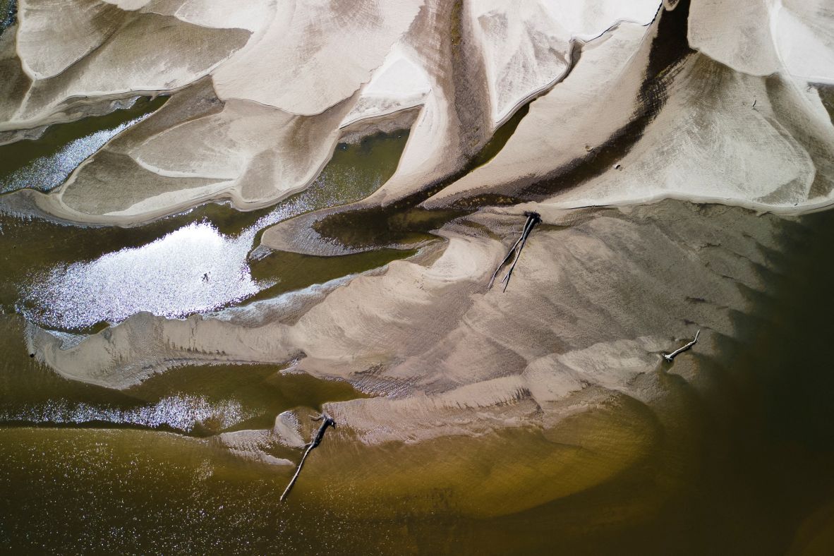 Low water levels are seen on the Vistula River amid a severe drought in Warsaw, Poland, on Thursday, July 3.