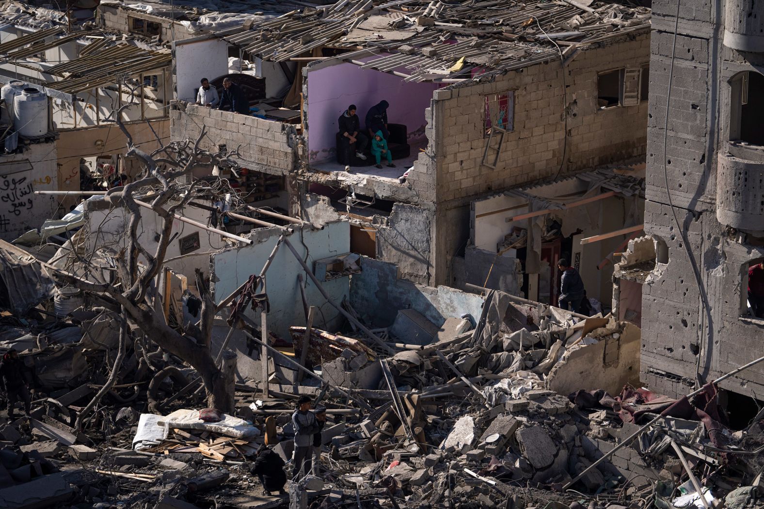 Palestinians look out at the destruction after there was an Israeli strike on residential buildings and a mosque in Rafah, Gaza, on February 22.