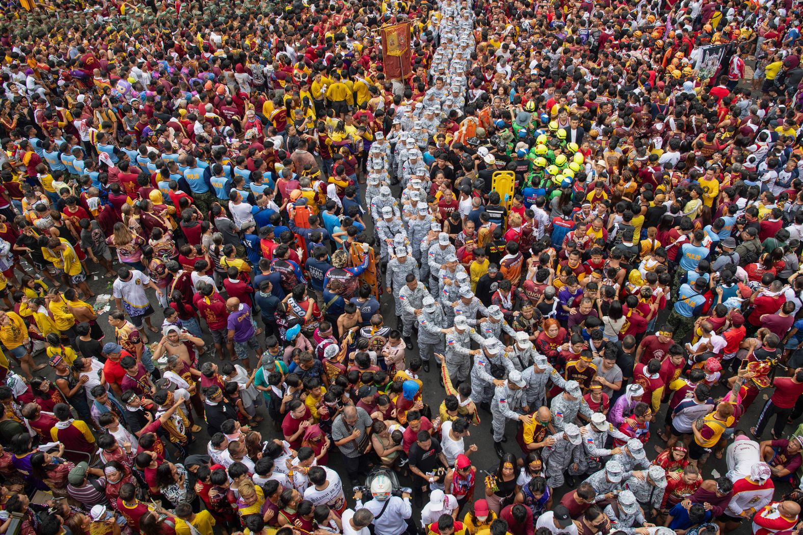 Military personnel walk through Catholic devotees during <a href="index.php?page=&url=https%3A%2F%2Fwww.cnn.com%2F2025%2F01%2F09%2Fasia%2Fphilippines-black-nazarene-procession-intl-hnk%2Findex.html">the annual religious procession of the Black Nazarene</a> in Manila, Philippines, on Thursday, January 9.