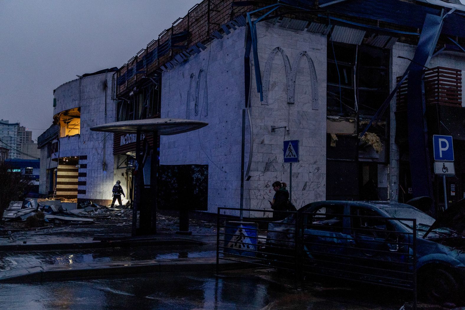 A firefighter searches the debris of a damaged metro station and McDonald’s restaurant after a <a href="index.php?page=&url=https%3A%2F%2Fwww.cnn.com%2F2025%2F01%2F18%2Feurope%2Frussia-ukraine-strike-kyiv-atacms-intl%2Findex.html">Russian rocket attack</a> in Kyiv, Ukraine, on Saturday, January 18.