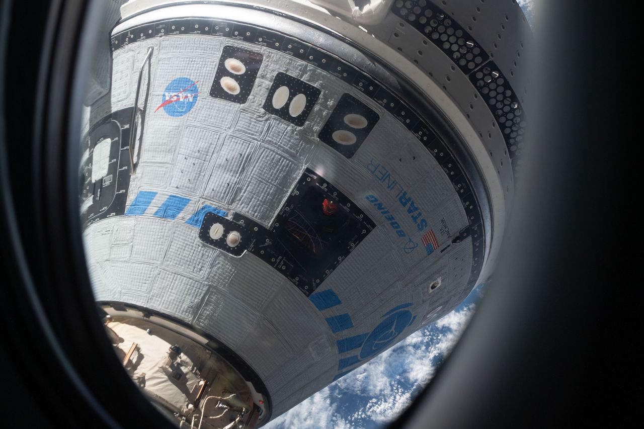 Boeing Starliner is shown docked to the International Space Station in May 2022 during the Orbital Flight Test 2 mission.