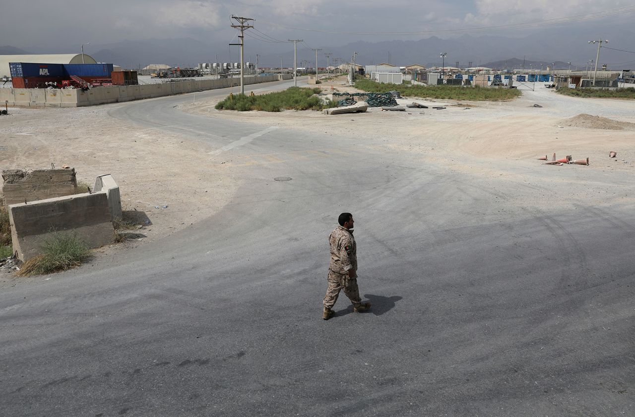 A member of Afghanistan's security forces walks at Bagram Air Base after the last American troops?departed the compound?in July 2021.