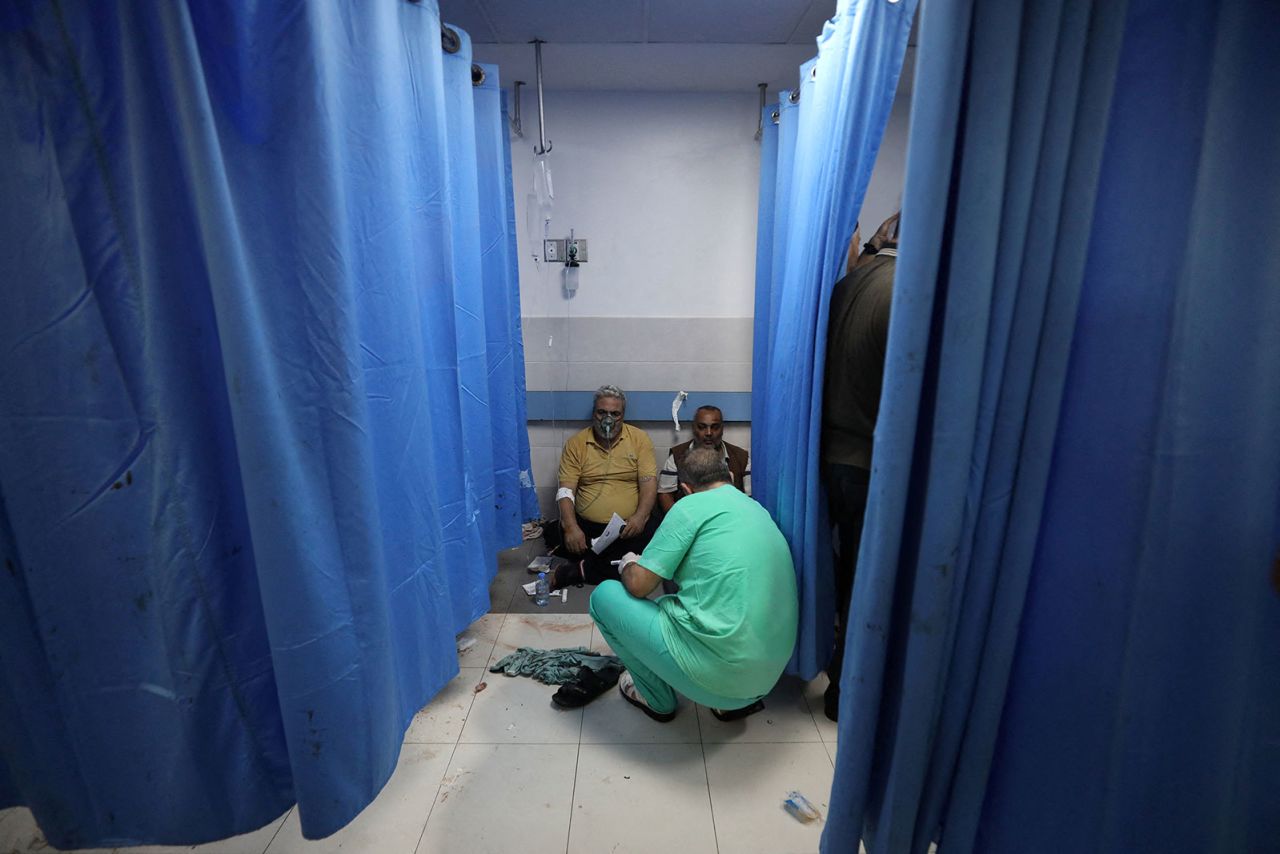 People are assisted at Shifa Hospital after the Al-Ahli Hospital was hit by a blast in Gaza City on Tuesday, October 17, 2023.