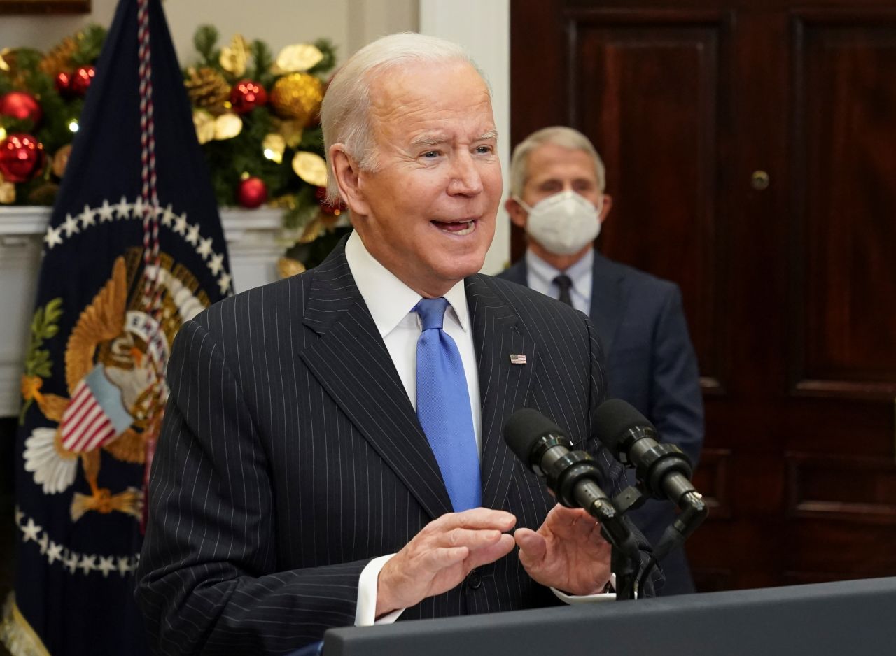 With Dr. Anthony Fauci standing behind, U.S. President Joe Biden delivers an update on the Omicron variant at the White House in Washington, U.S., November 29, 2021