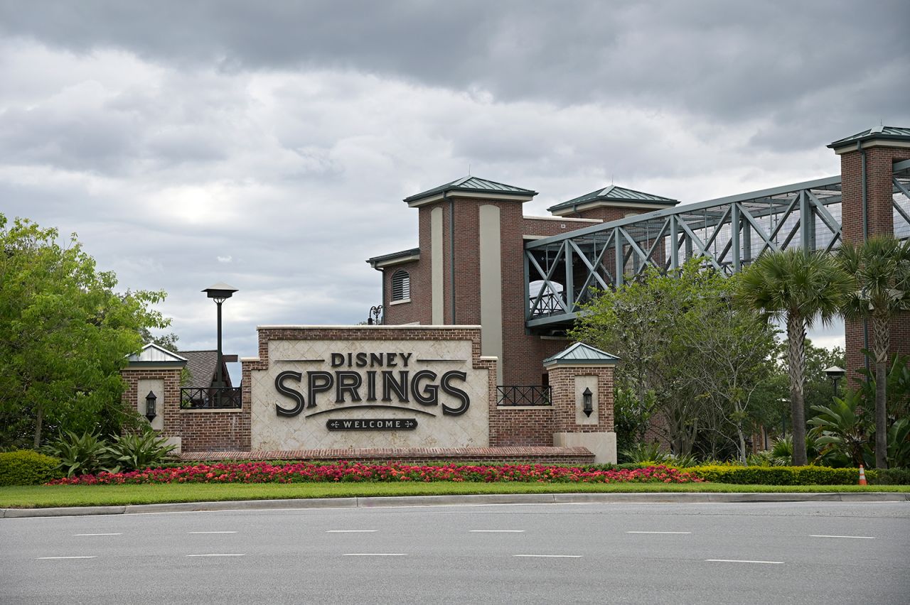 An empty street is viewed in front of the Disney Springs shopping and entertainment district, on Monday, April 6, in Lake Buena Vista, Florida.