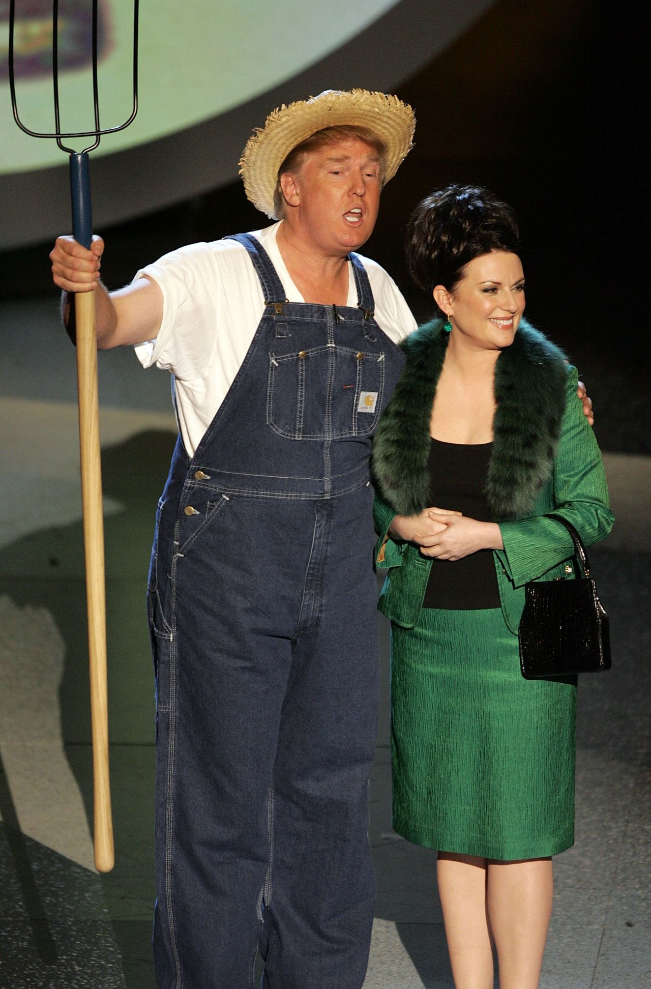 Trump and Actress Megan Mullally perform the Green Acres Theme onstage at the 57th Annual Emmy Awards in 2005 in Los Angeles, California.