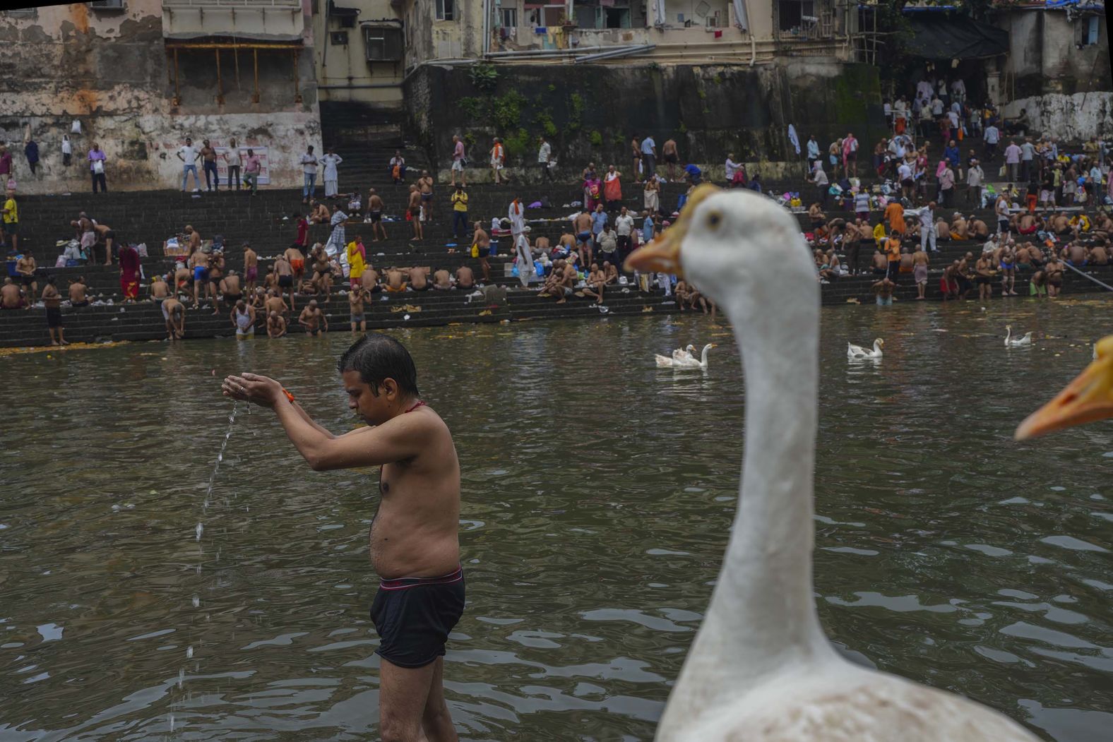 A Hindu devotee performs rituals during the Mahalaya festival in Mumbai, India, on Sunday, September 21.