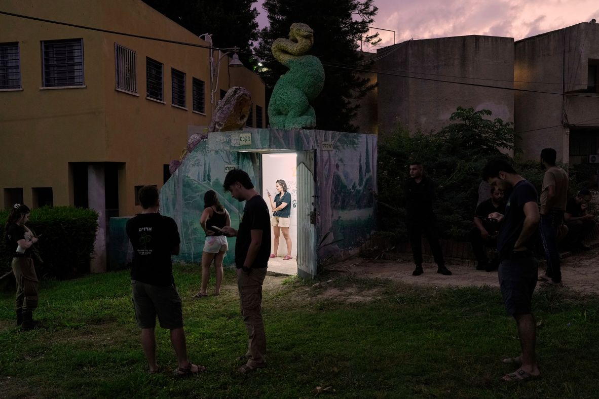 People in Holon, Israel, gather near a public bomb shelter after receiving a message about an incoming missile launched from Iran on Tuesday, June 24. The ceasefire between Iran and Israel went into effect that day. <a  target="_top" href="/newspapers?url=https://www.cnn.com/2025/06/19/world/gallery/photos-this-week-june-12-june-19">See last week in 37 photos</a>.