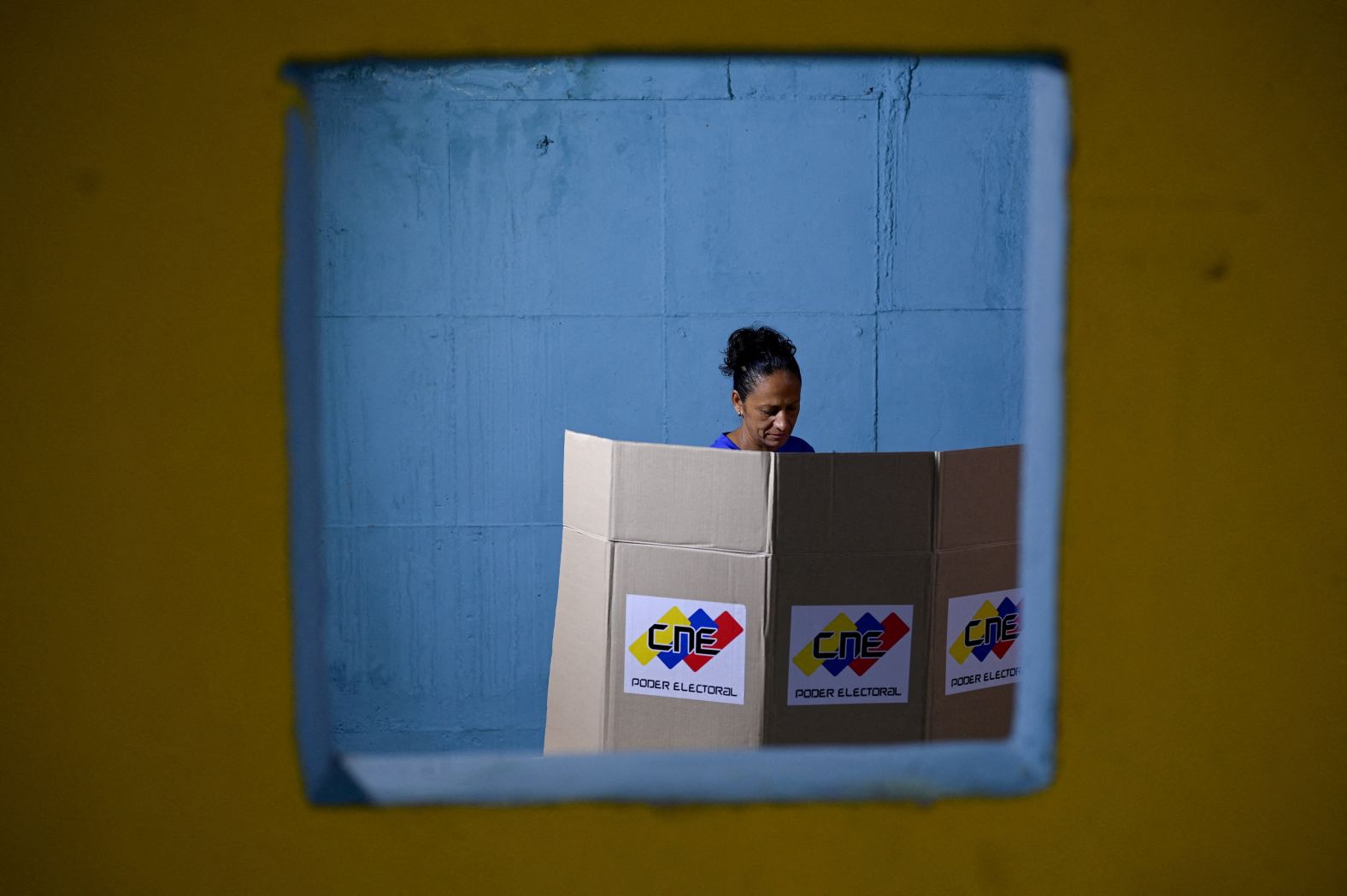 A woman in Caracas, Venezuela, votes during mayoral and council elections on Sunday, July 27.