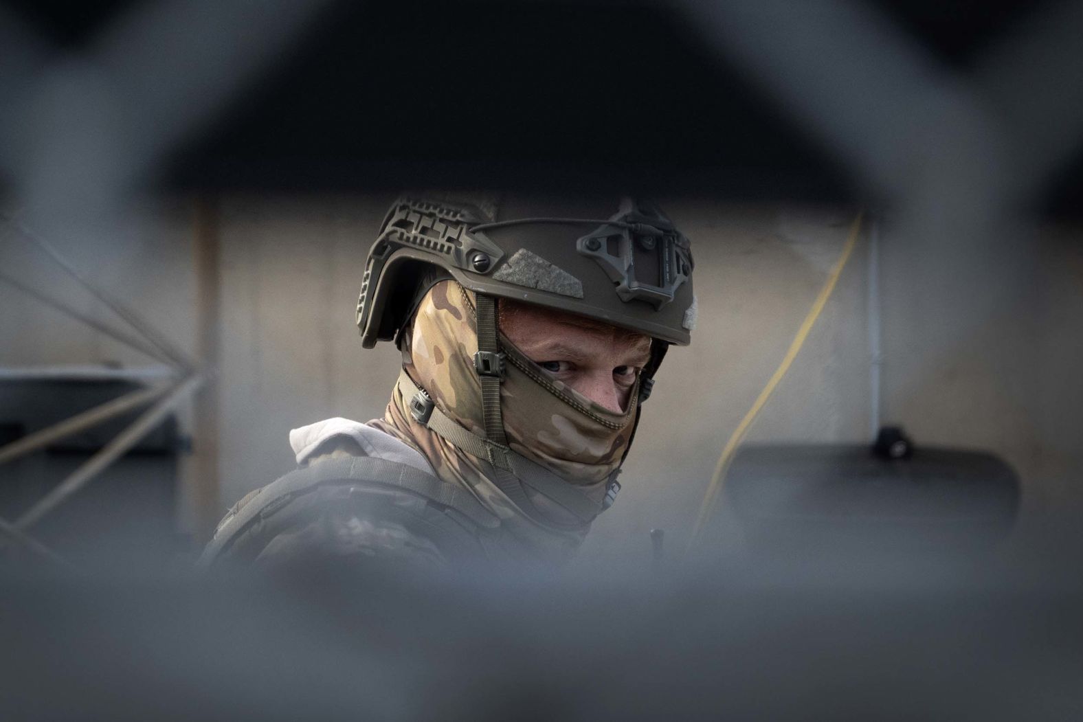 A federal police officer keeps watch inside a fenced area as demonstrators protest outside of an immigration processing center in Broadview, Illinois, on Friday, September 12. The demonstrators were protesting the Trump administration's increase in <a href="index.php?page=&url=https%3A%2F%2Fwww.cnn.com%2F2025%2F09%2F08%2Fus%2Fchicago-sanctuary-cities-ice-raids-planned">immigration enforcement operations in the area</a>.