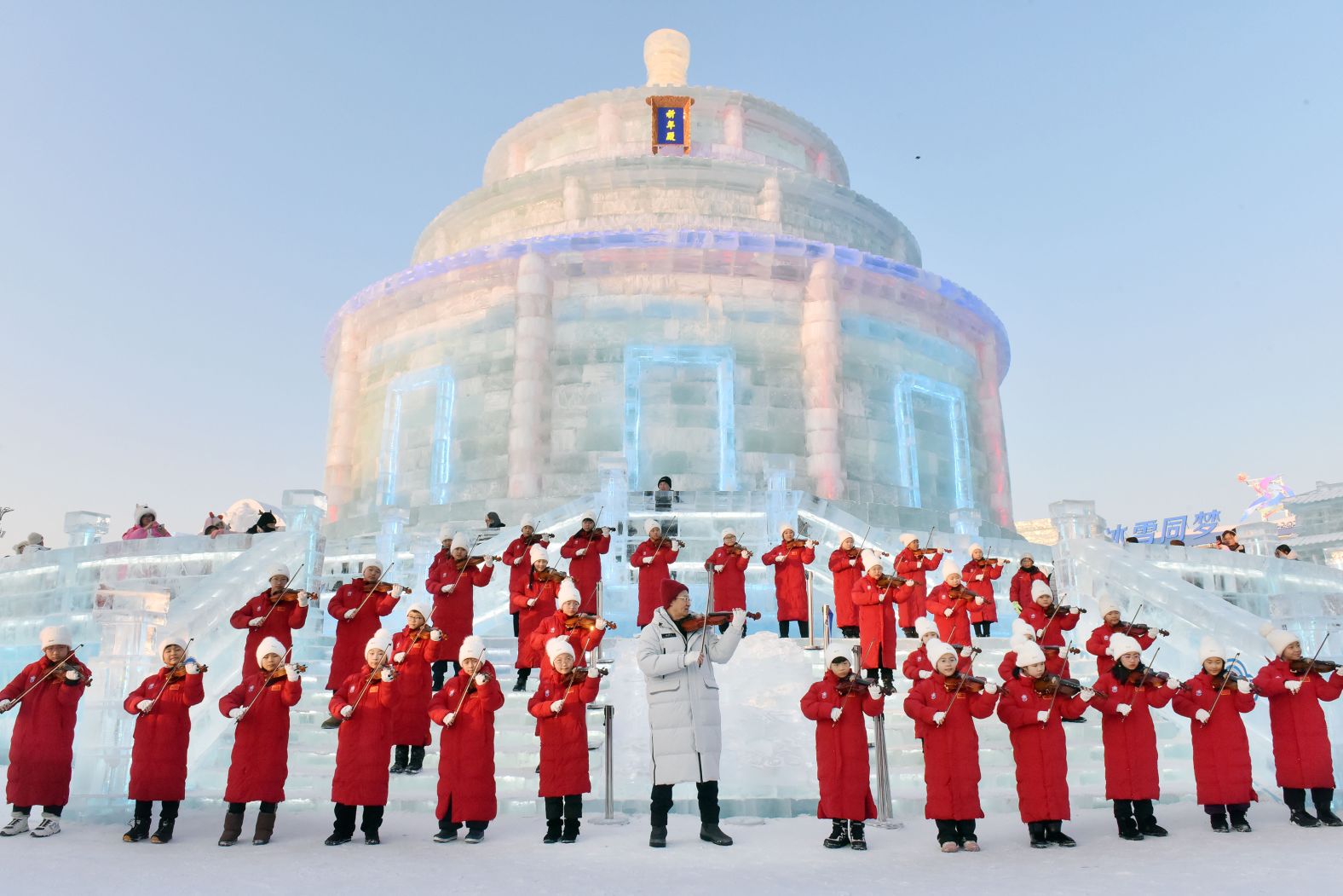 Members from the Harbin Schoenfeld Children's Arts Society take part in a violin flash mob at the Harbin Ice and Snow World in Harbin, China, on Sunday, January 12. <a href="index.php?page=&url=https%3A%2F%2Fwww.cnn.com%2F2025%2F01%2F09%2Fworld%2Fgallery%2Fphotos-this-week-january-2-january-9%2Findex.html">See last week in 40 photos</a>.