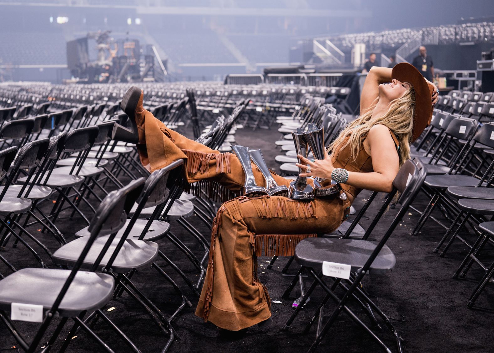 Singer Lainey Wilson sits with several statues she won during the <a href="index.php?page=&url=https%3A%2F%2Fwww.cnn.com%2F2025%2F05%2F08%2Fentertainment%2Facm-awards-2025-see-who-won">Academy of Country Music Awards</a>, which took place in Frisco, Texas, on Thursday, May 8. Among the awards she won was entertainer of the year.