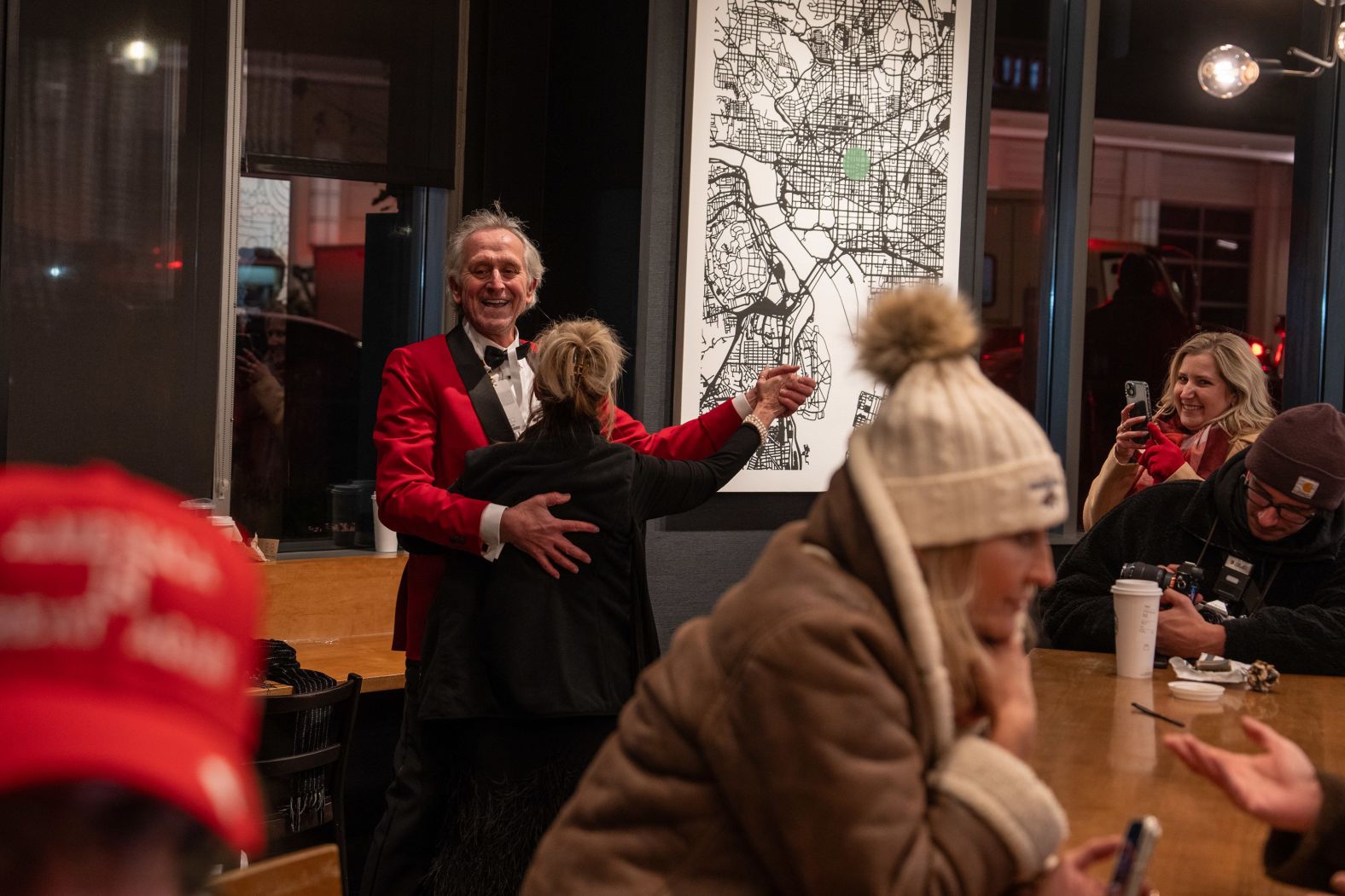 After deciding the line was too long for the inaugural ball they planned on attending, Atlanta residents Kevin McCarthy and Janice Hall have an impromptu dance at a Starbucks in Washington, DC, on Monday, January 20.