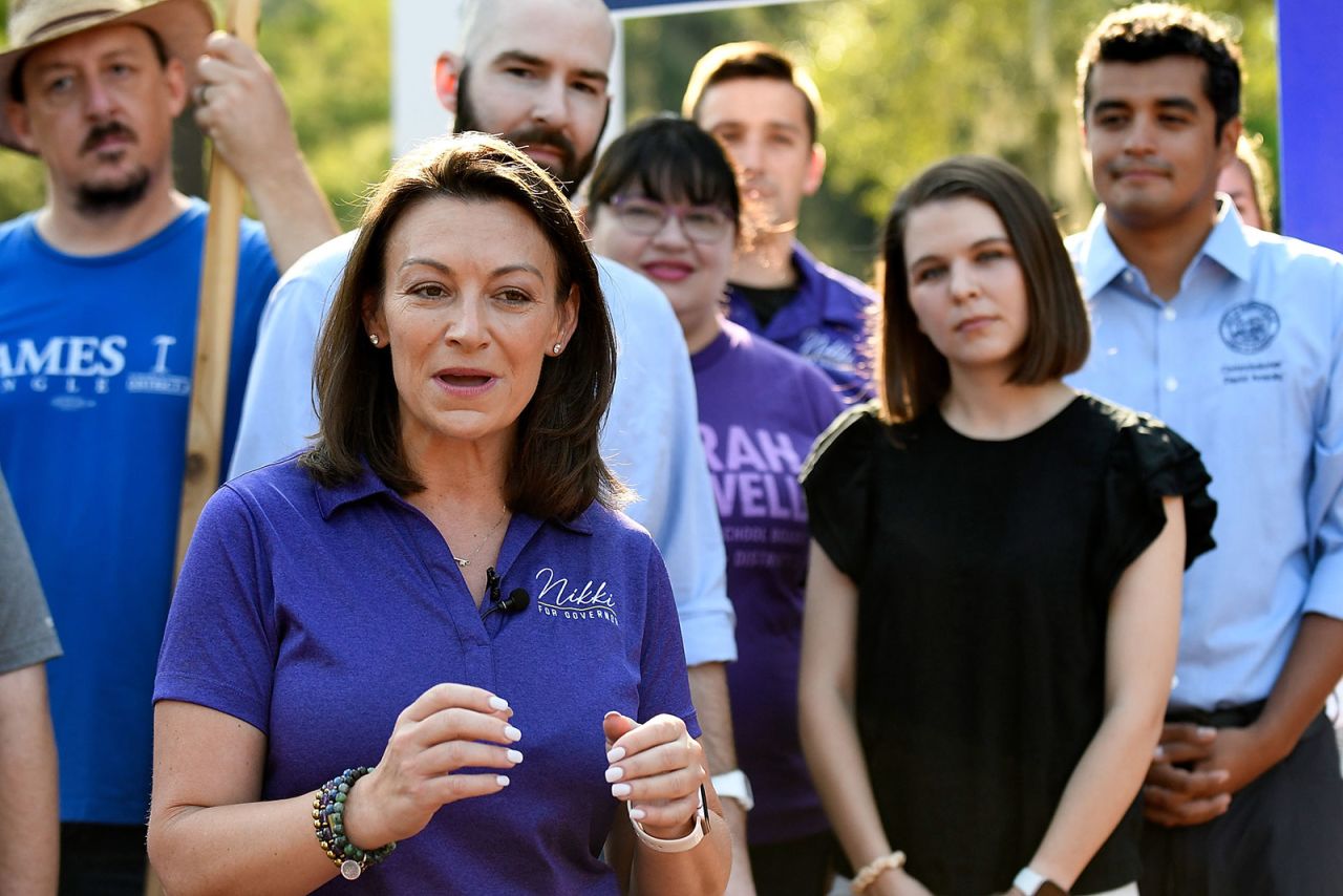 Nikki Fried?speaks with members of the media during her bus tour on August 18 in Gainesville, Florida.